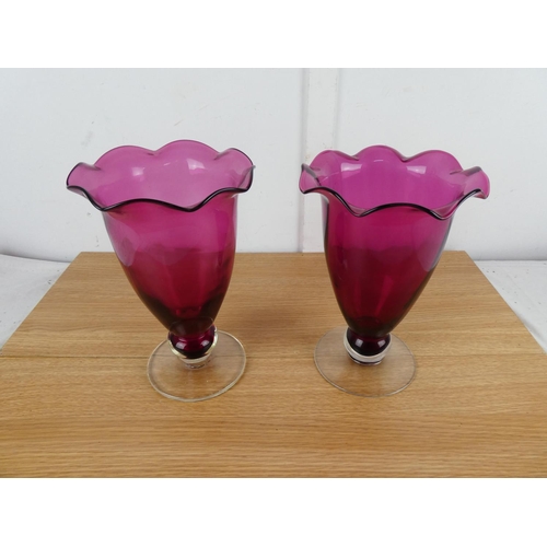 832 - A stunning large pair of ruby glass vases.