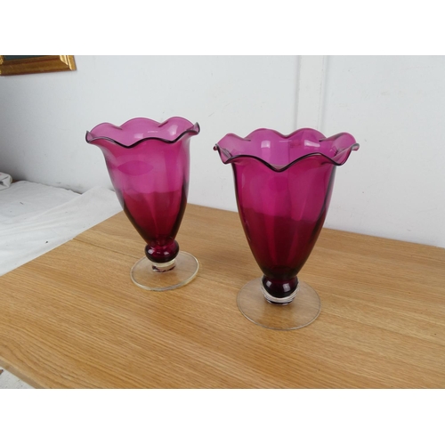 832 - A stunning large pair of ruby glass vases.