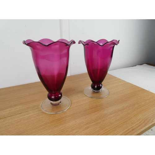 832 - A stunning large pair of ruby glass vases.