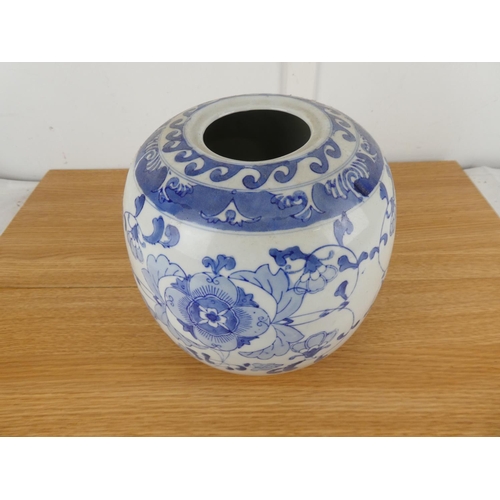 838 - A large blue and white oriental style vase.