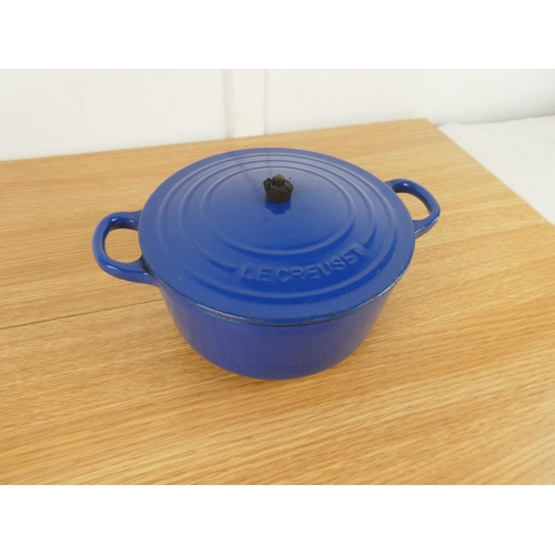 848 - A Le Creuset blue lidded casserole dish. (handle a/f)