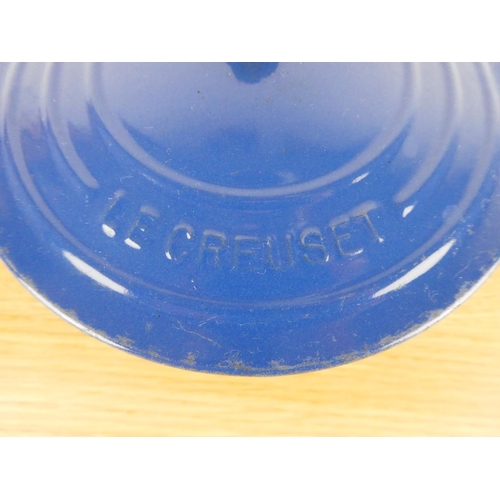 848 - A Le Creuset blue lidded casserole dish. (handle a/f)