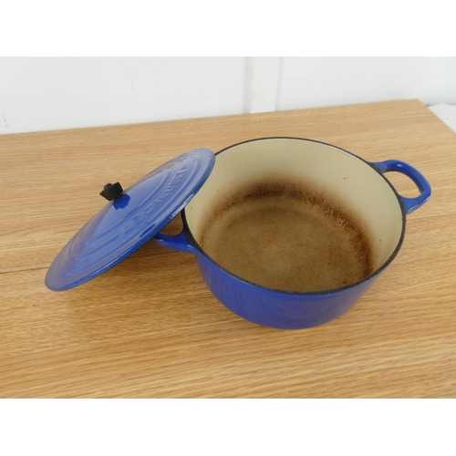 848 - A Le Creuset blue lidded casserole dish. (handle a/f)