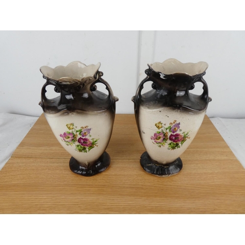 858 - A pair of antique floral pattern mantle vases (a/f).