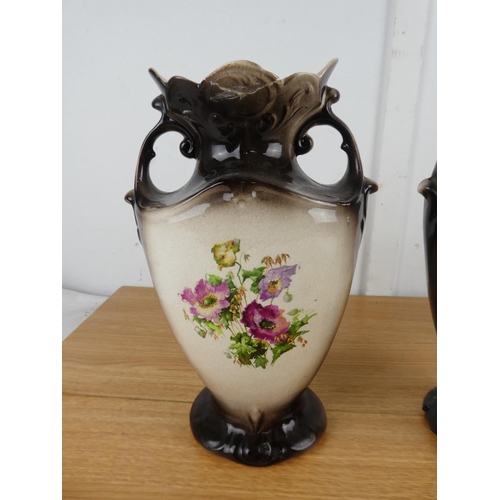 858 - A pair of antique floral pattern mantle vases (a/f).