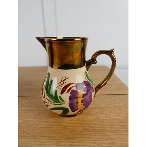 872 - A Wade hand painted jug and another.