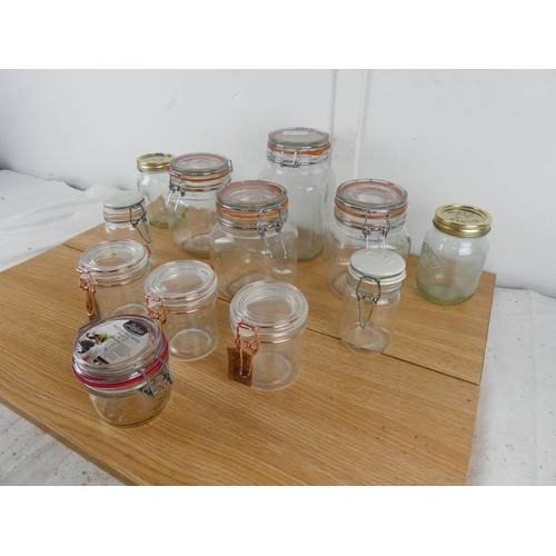 880 - A lot of jam jars with clip lids and more.