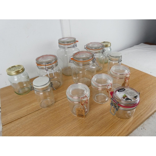 880 - A lot of jam jars with clip lids and more.