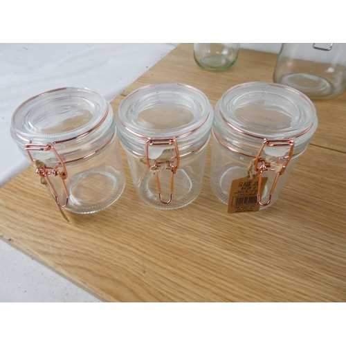 880 - A lot of jam jars with clip lids and more.