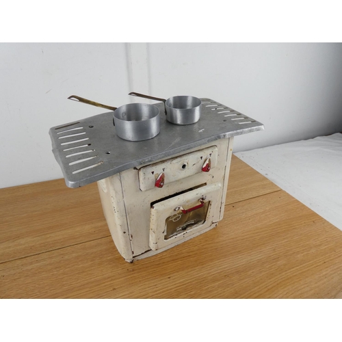 886 - A vintage tin plate toy stove.