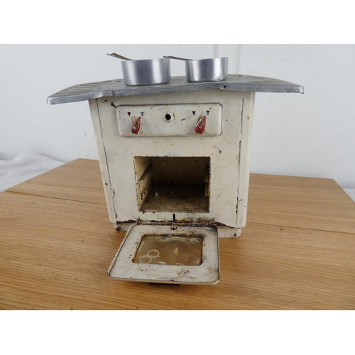 886 - A vintage tin plate toy stove.