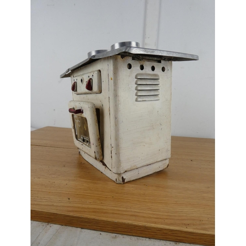 886 - A vintage tin plate toy stove.