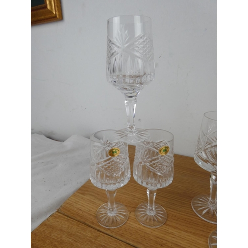 891 - A set of nine and a set of six Tyrone crystal glasses.