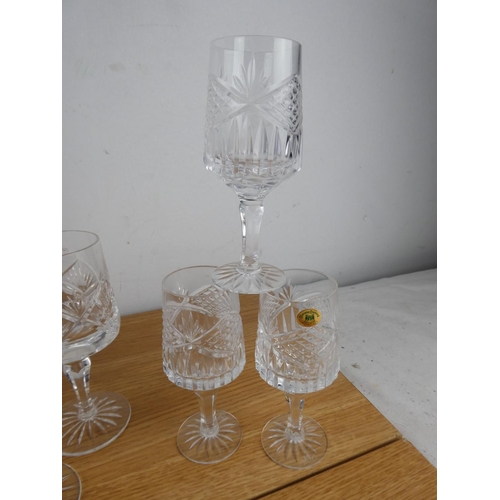 891 - A set of nine and a set of six Tyrone crystal glasses.