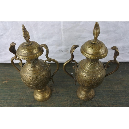 901 - A pair of antique brass lidded urns with snake detail.