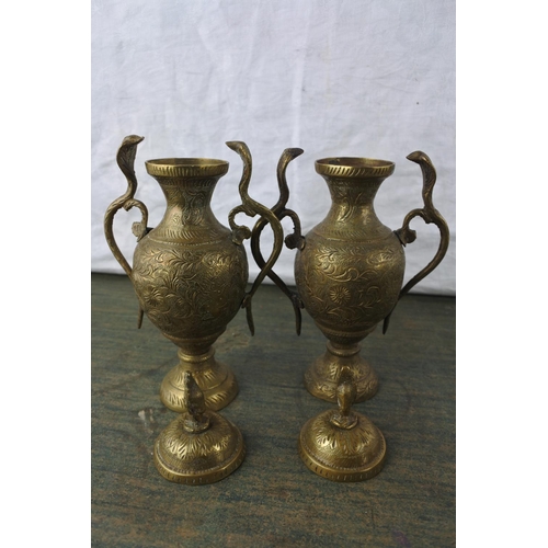 901 - A pair of antique brass lidded urns with snake detail.