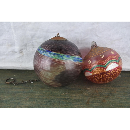 939 - A handblown glass ball and another.