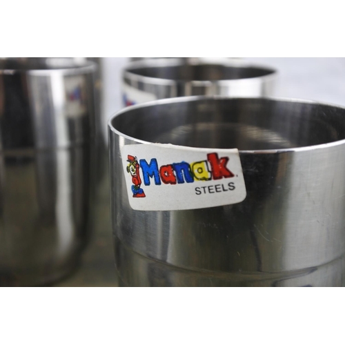 943 - Six manak steel tumblers and more.