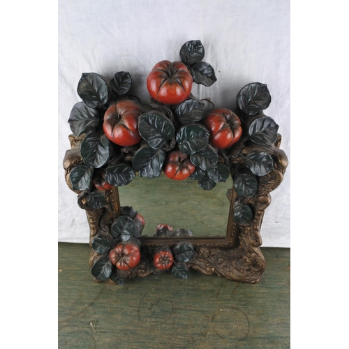 944 - A heavy wall mirror decorated with apples, measuring 50cm x 39cm x 10cm in size.