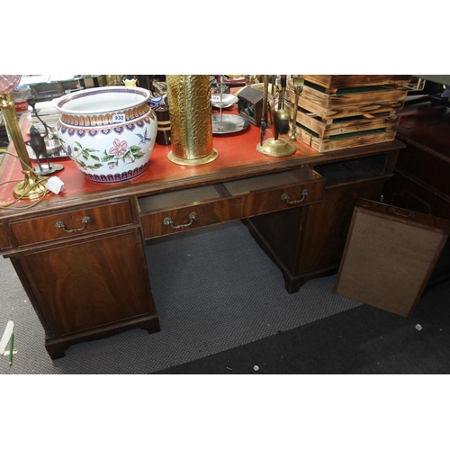 948 - A stunning mahogany partners desk with red leather top, measuring 77cm x 168cm x 116cm in size.