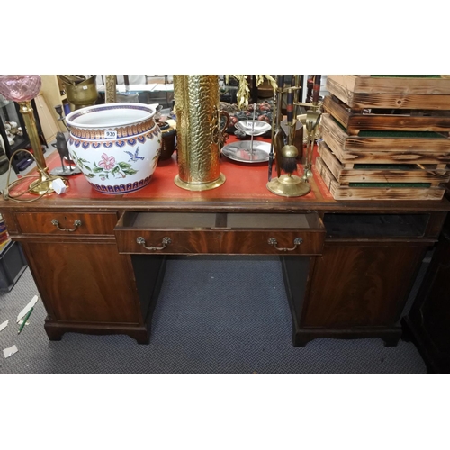 948 - A stunning mahogany partners desk with red leather top, measuring 77cm x 168cm x 116cm in size.