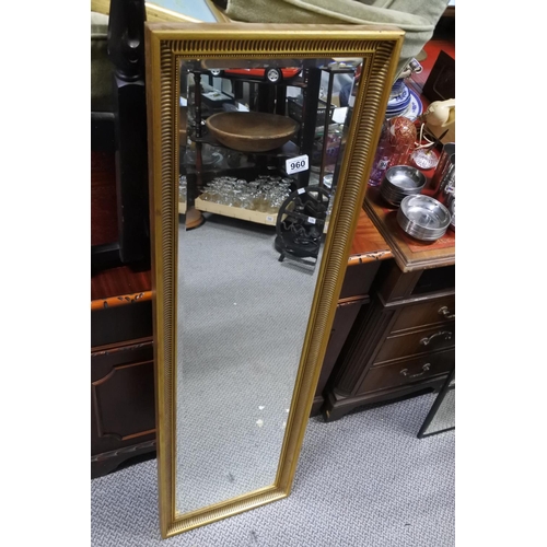 960 - A gilt framed rectangular wall mirror, measuring 129cm x 38cm.