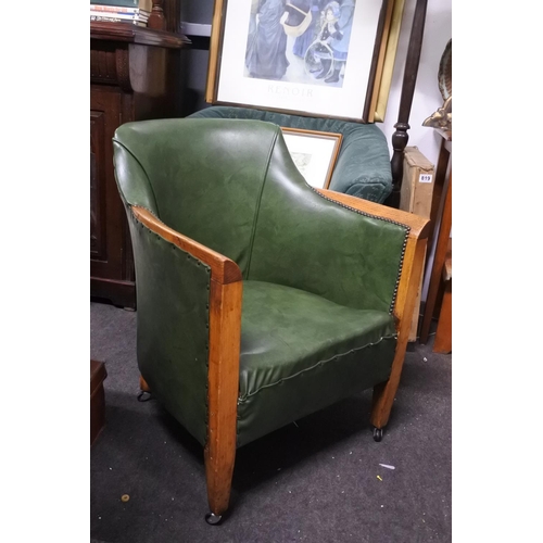 961 - An oak framed tub style chair on casters.