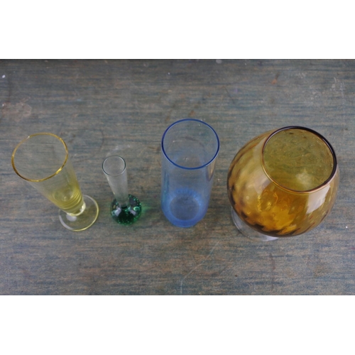 981 - A stunning green glass bud vase and other glassware.