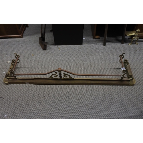 992 - An antique brass and copper fire fender, measuring 136cm in width (extendable).