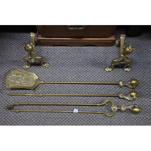 993 - A set of brass fire irons and dogs.