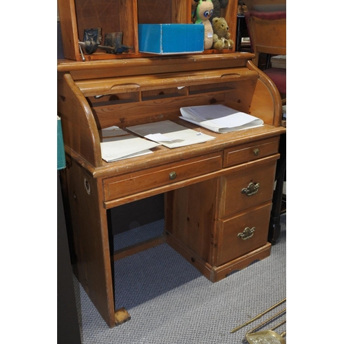 995 - A small roll topped desk, measuring 110cm x 104cm x 49cm approximately.