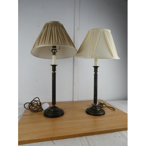 1003 - A pair of metal based table lamps and shades.