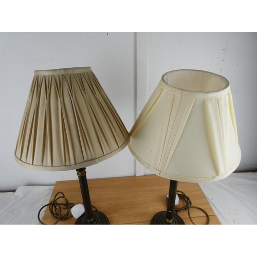 1003 - A pair of metal based table lamps and shades.