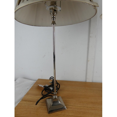 1004 - A pair of metal based table lamps and shades.