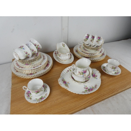 1034 - A large collection of Royal Albert 'Moss Rose' tea and dinner set.