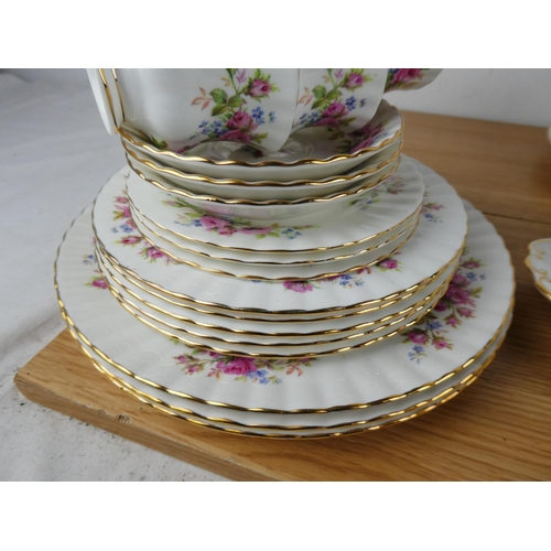 1034 - A large collection of Royal Albert 'Moss Rose' tea and dinner set.