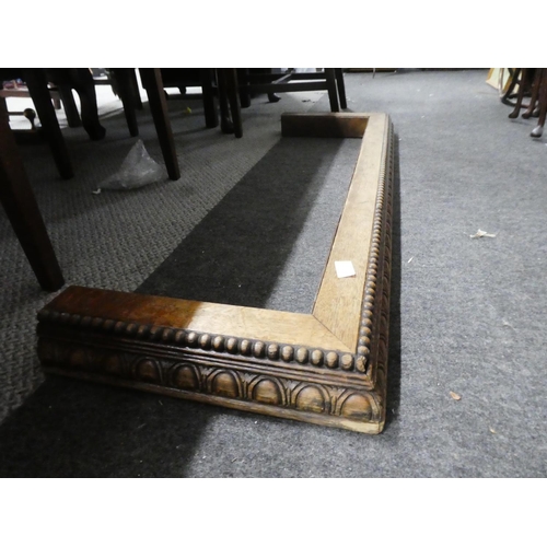 1039 - A carved oak fender, measuring 105cm x 30cm approximately.