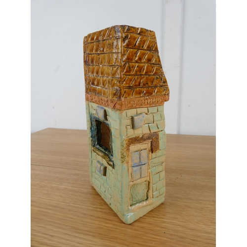 1043 - A studio pottery ornament of a house.