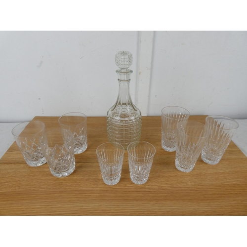 1045 - A glass decanter, a set of three and two Waterford crystal glasses and more.