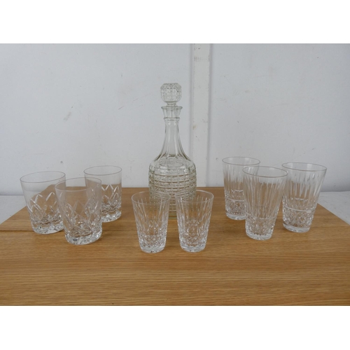 1045 - A glass decanter, a set of three and two Waterford crystal glasses and more.