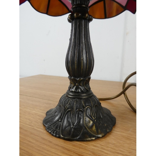 1047 - A leaded glass table lamp and shade.