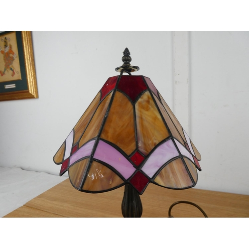 1047 - A leaded glass table lamp and shade.