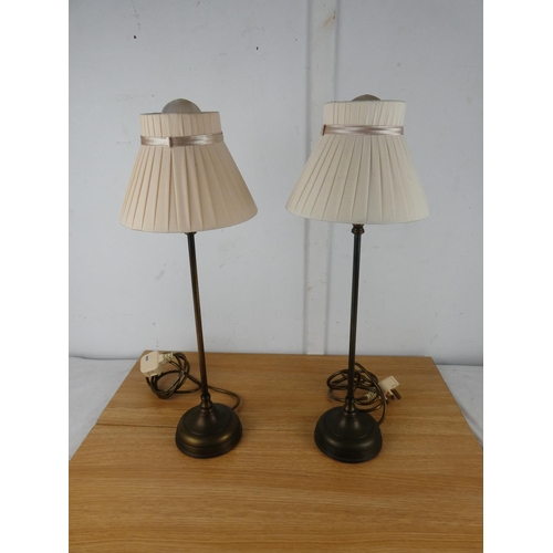 1050 - A pair of metal based table lamps and shades.