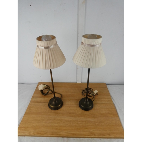 1050 - A pair of metal based table lamps and shades.