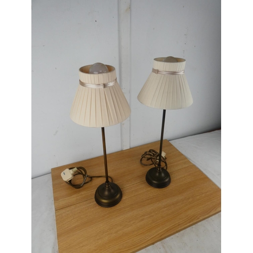 1050 - A pair of metal based table lamps and shades.