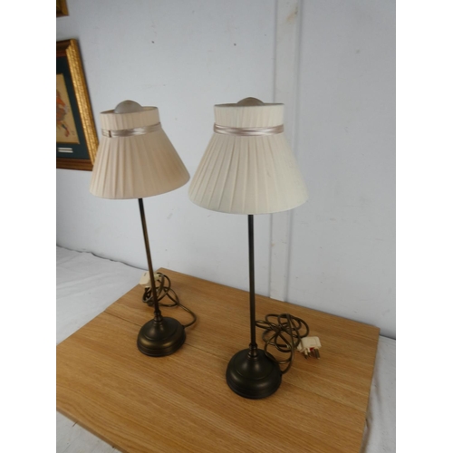 1050 - A pair of metal based table lamps and shades.