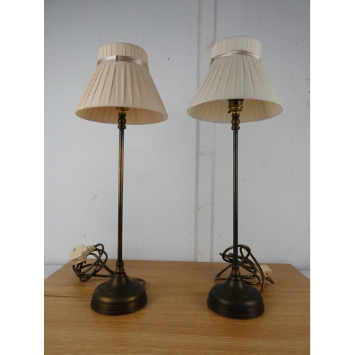 1050 - A pair of metal based table lamps and shades.