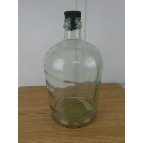 1051 - A large glass lidded bottle.