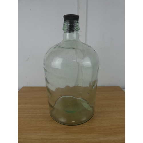 1051 - A large glass lidded bottle.