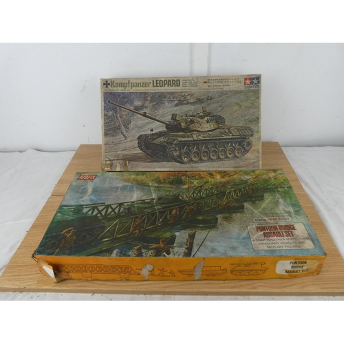 1068 - A vintage Tamiya Kamp F Panzer Leopard Kit box and a vintage Pontoon Bridge Assault Set box with som... 